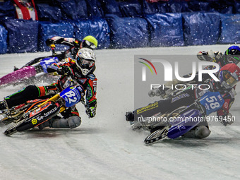 Stefan Svensson (58) (Red) inside Markus Jell (82) (White) with Harald Simon (50) (Blue) and Lukas Hutla (212) behind during the Ice Speedwa...