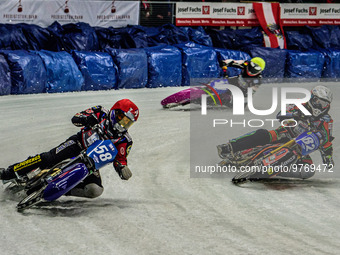 Stefan Svensson (58) (Red) outside Markus Jell (82) (White) and Benedikt Monn (17) (Reserve) (Yellow) during the Ice Speedway Gladiators Wor...