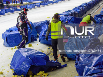 Benedikt Monn (17) (Reserve) goes to retrieve his machine after coming off  during the Ice Speedway Gladiators World Championship Final 1 at...