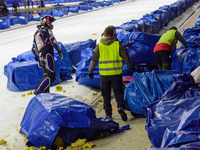 Benedikt Monn (17) (Reserve) goes to retrieve his machine after coming off  during the Ice Speedway Gladiators World Championship Final 1 at...