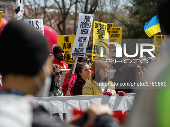 Demonstrators march in Washington, D.C. on March 18, 2023 during an anti-war protest organized by the Answer Coalition and dozens of other g...