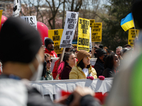 Demonstrators march in Washington, D.C. on March 18, 2023 during an anti-war protest organized by the Answer Coalition and dozens of other g...