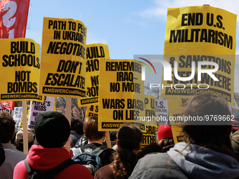 Demonstrators march in Washington, D.C. on March 18, 2023 during an anti-war protest organized by the Answer Coalition and dozens of other g...