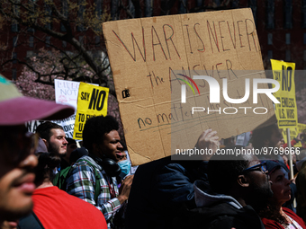 Demonstrators march in Washington, D.C. on March 18, 2023 during an anti-war protest organized by the Answer Coalition and dozens of other g...