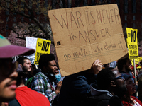 Demonstrators march in Washington, D.C. on March 18, 2023 during an anti-war protest organized by the Answer Coalition and dozens of other g...