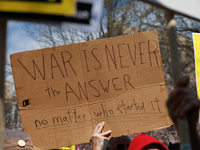 Demonstrators march in Washington, D.C. on March 18, 2023 during an anti-war protest organized by the Answer Coalition and dozens of other g...