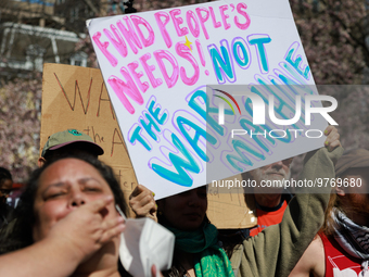 Demonstrators march in Washington, D.C. on March 18, 2023 during an anti-war protest organized by the Answer Coalition and dozens of other g...