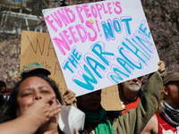 Demonstrators march in Washington, D.C. on March 18, 2023 during an anti-war protest organized by the Answer Coalition and dozens of other g...