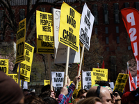 Demonstrators march in Washington, D.C. on March 18, 2023 during an anti-war protest organized by the Answer Coalition and dozens of other g...