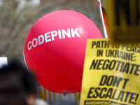 A balloon bearing the name of the activist group CodePink floats during an anti-war protest in Washington, D.C. on March 18, 2023. The prote...