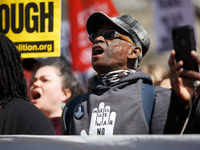 Demonstrators march in Washington, D.C. on March 18, 2023 during an anti-war protest organized by the Answer Coalition and dozens of other g...