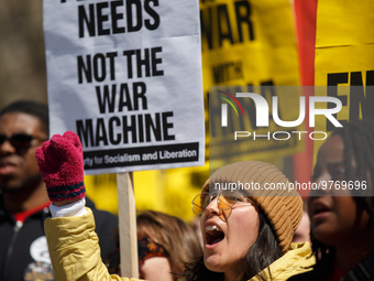 Demonstrators march in Washington, D.C. on March 18, 2023 during an anti-war protest organized by the Answer Coalition and dozens of other g...