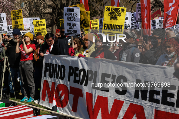 Demonstrators march in Washington, D.C. on March 18, 2023 during an anti-war protest organized by the Answer Coalition and dozens of other g...