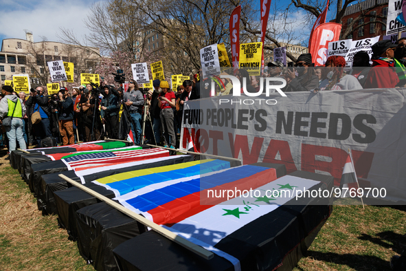 Demonstrators march in Washington, D.C. on March 18, 2023 during an anti-war protest organized by the Answer Coalition and dozens of other g...