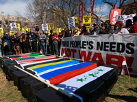 Demonstrators march in Washington, D.C. on March 18, 2023 during an anti-war protest organized by the Answer Coalition and dozens of other g...