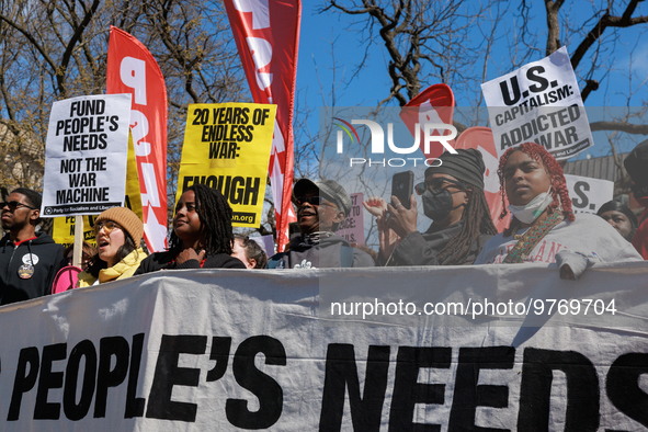 Demonstrators march in Washington, D.C. on March 18, 2023 during an anti-war protest organized by the Answer Coalition and dozens of other g...