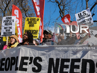 Demonstrators march in Washington, D.C. on March 18, 2023 during an anti-war protest organized by the Answer Coalition and dozens of other g...