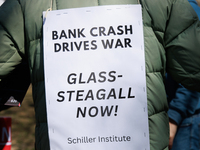 A demonstrator wears a sign during an anti-war protest in Washington, D.C. on March 18, 2023. The protest, organized by the Answer Coalition...