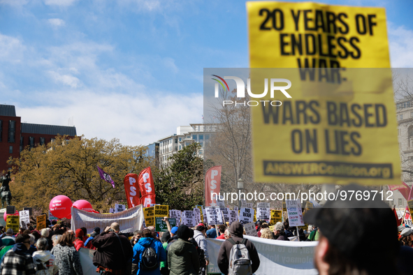 Demonstrators march in Washington, D.C. on March 18, 2023 during an anti-war protest organized by the Answer Coalition and dozens of other g...