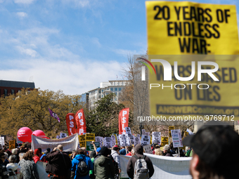 Demonstrators march in Washington, D.C. on March 18, 2023 during an anti-war protest organized by the Answer Coalition and dozens of other g...