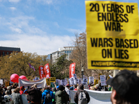 Demonstrators march in Washington, D.C. on March 18, 2023 during an anti-war protest organized by the Answer Coalition and dozens of other g...