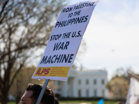 A demonstrator holds a sign during an anti-war protest in Washington, D.C. on March 18, 2023. The protest, organized by the Answer Coalition...