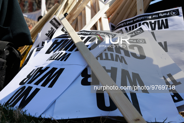 Protest signs lay on the ground during an anti-war protest in Washington, D.C. on March 18, 2023. The protest, organized by the Answer Coali...