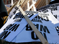 Protest signs lay on the ground during an anti-war protest in Washington, D.C. on March 18, 2023. The protest, organized by the Answer Coali...