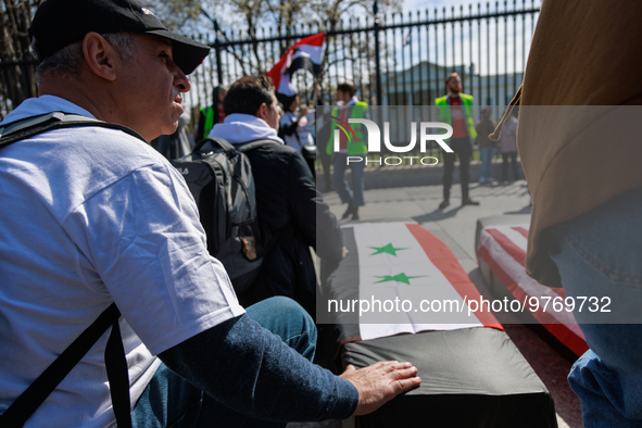 Demonstrators place symbolic body caskets on the ground in front of the White House during an anti-war protest in Washington, D.C. on March...