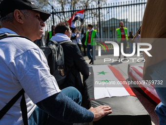 Demonstrators place symbolic body caskets on the ground in front of the White House during an anti-war protest in Washington, D.C. on March...