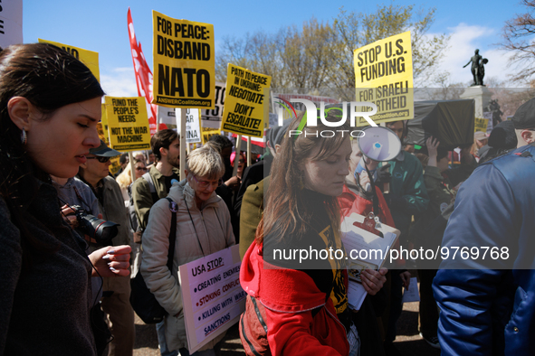 Demonstrators march in Washington, D.C. on March 18, 2023 during an anti-war protest organized by the Answer Coalition and dozens of other g...