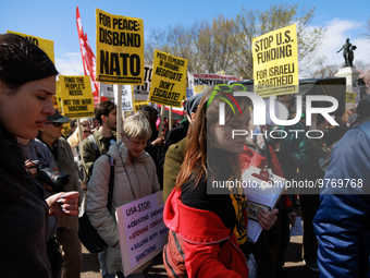 Demonstrators march in Washington, D.C. on March 18, 2023 during an anti-war protest organized by the Answer Coalition and dozens of other g...