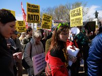 Demonstrators march in Washington, D.C. on March 18, 2023 during an anti-war protest organized by the Answer Coalition and dozens of other g...