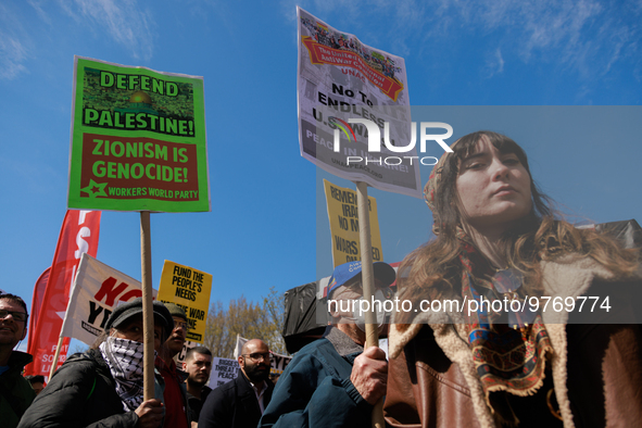 Demonstrators march in Washington, D.C. on March 18, 2023 during an anti-war protest organized by the Answer Coalition and dozens of other g...