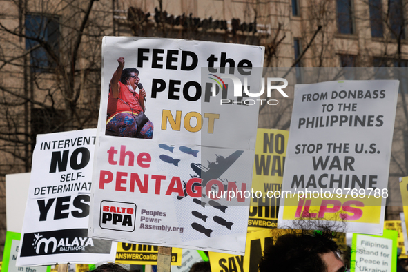 Demonstrators protest outside of the offices of The Washington Post in Washington, D.C. on March 18, 2023 during an anti-war march organized...