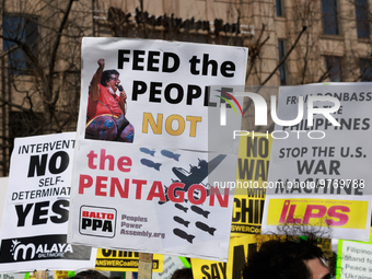 Demonstrators protest outside of the offices of The Washington Post in Washington, D.C. on March 18, 2023 during an anti-war march organized...