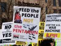 Demonstrators protest outside of the offices of The Washington Post in Washington, D.C. on March 18, 2023 during an anti-war march organized...