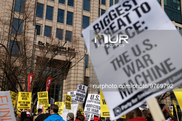 Demonstrators protest outside of the offices of The Washington Post in Washington, D.C. on March 18, 2023 during an anti-war march organized...