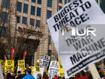 Demonstrators protest outside of the offices of The Washington Post in Washington, D.C. on March 18, 2023 during an anti-war march organized...