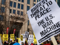 Demonstrators protest outside of the offices of The Washington Post in Washington, D.C. on March 18, 2023 during an anti-war march organized...