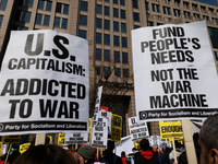 Demonstrators protest outside of the offices of The Washington Post in Washington, D.C. on March 18, 2023 during an anti-war march organized...