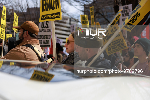 Demonstrators protest outside of the offices of The Washington Post in Washington, D.C. on March 18, 2023 during an anti-war march organized...