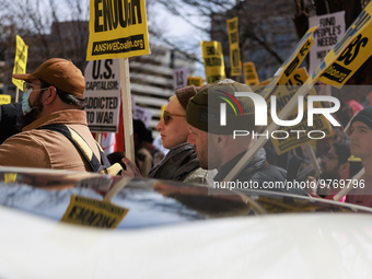 Demonstrators protest outside of the offices of The Washington Post in Washington, D.C. on March 18, 2023 during an anti-war march organized...