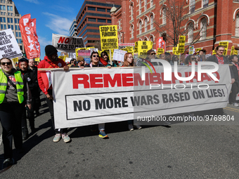 Demonstrators march in Washington, D.C. on March 18, 2023 during an anti-war protest organized by the Answer Coalition and dozens of other g...