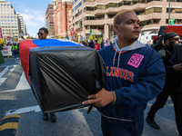 Demonstrators march in Washington, D.C. on March 18, 2023 during an anti-war protest organized by the Answer Coalition and dozens of other g...