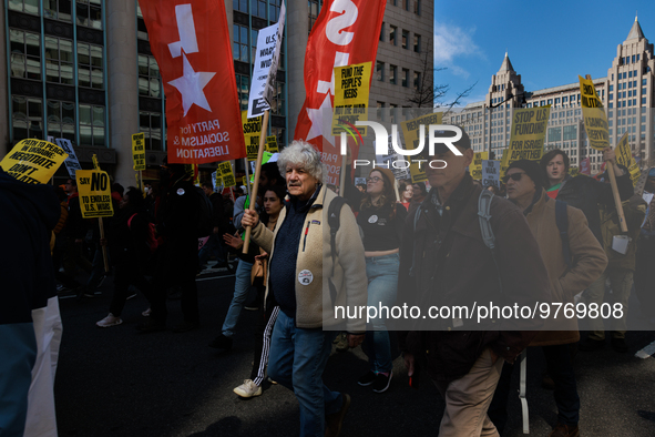 Demonstrators march in Washington, D.C. on March 18, 2023 during an anti-war protest organized by the Answer Coalition and dozens of other g...