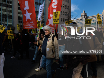 Demonstrators march in Washington, D.C. on March 18, 2023 during an anti-war protest organized by the Answer Coalition and dozens of other g...