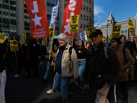 Demonstrators march in Washington, D.C. on March 18, 2023 during an anti-war protest organized by the Answer Coalition and dozens of other g...