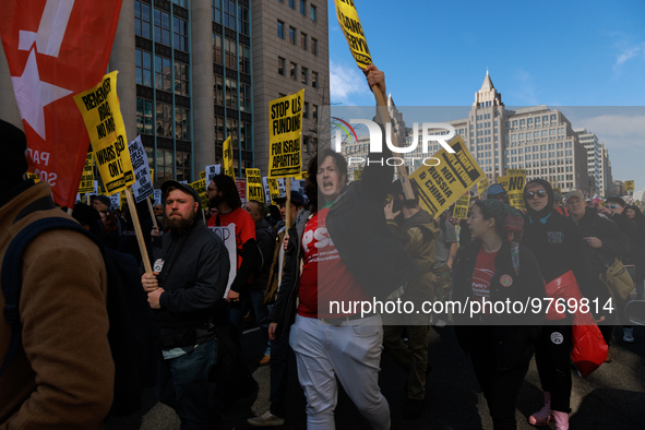 Demonstrators march in Washington, D.C. on March 18, 2023 during an anti-war protest organized by the Answer Coalition and dozens of other g...