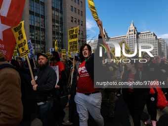 Demonstrators march in Washington, D.C. on March 18, 2023 during an anti-war protest organized by the Answer Coalition and dozens of other g...